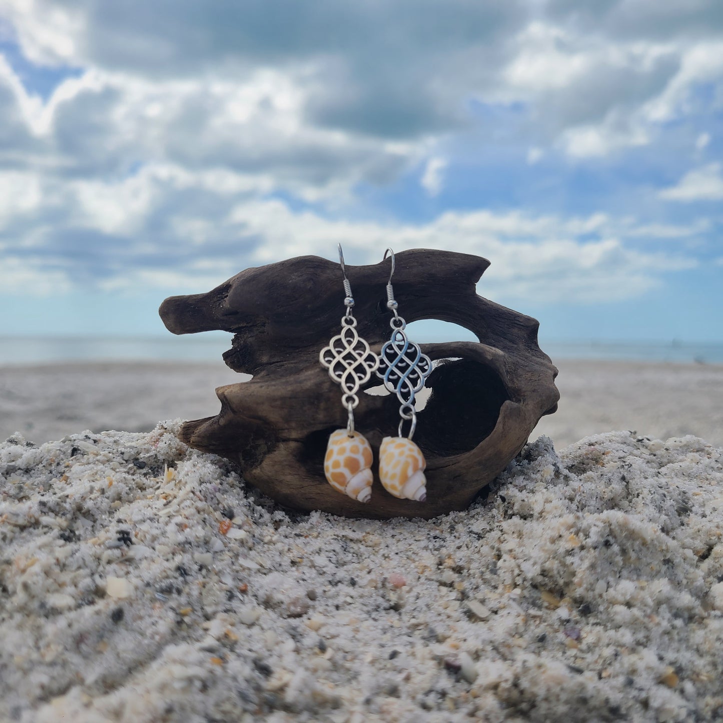 Beautiful Dainty Giraffe Print Babylonia Dangle Shell Earrings.