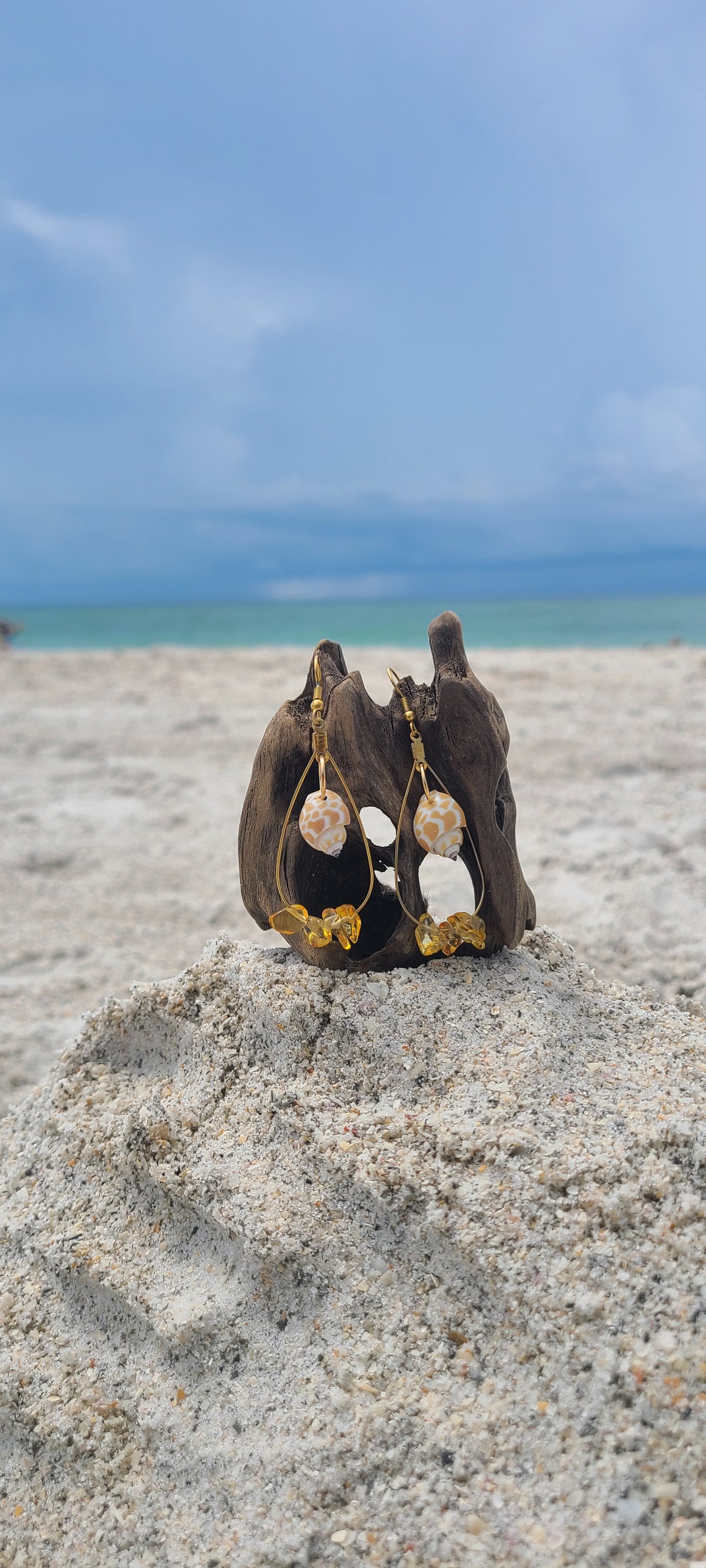 Beautiful Dangle Earrings with Giraffe Print Babylonia Shells and Yellow Amber Colored Stones.