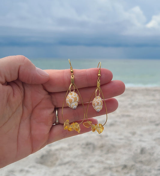 Beautiful Dangle Earrings with Giraffe Print Babylonia Shells and Yellow Amber Colored Stones.