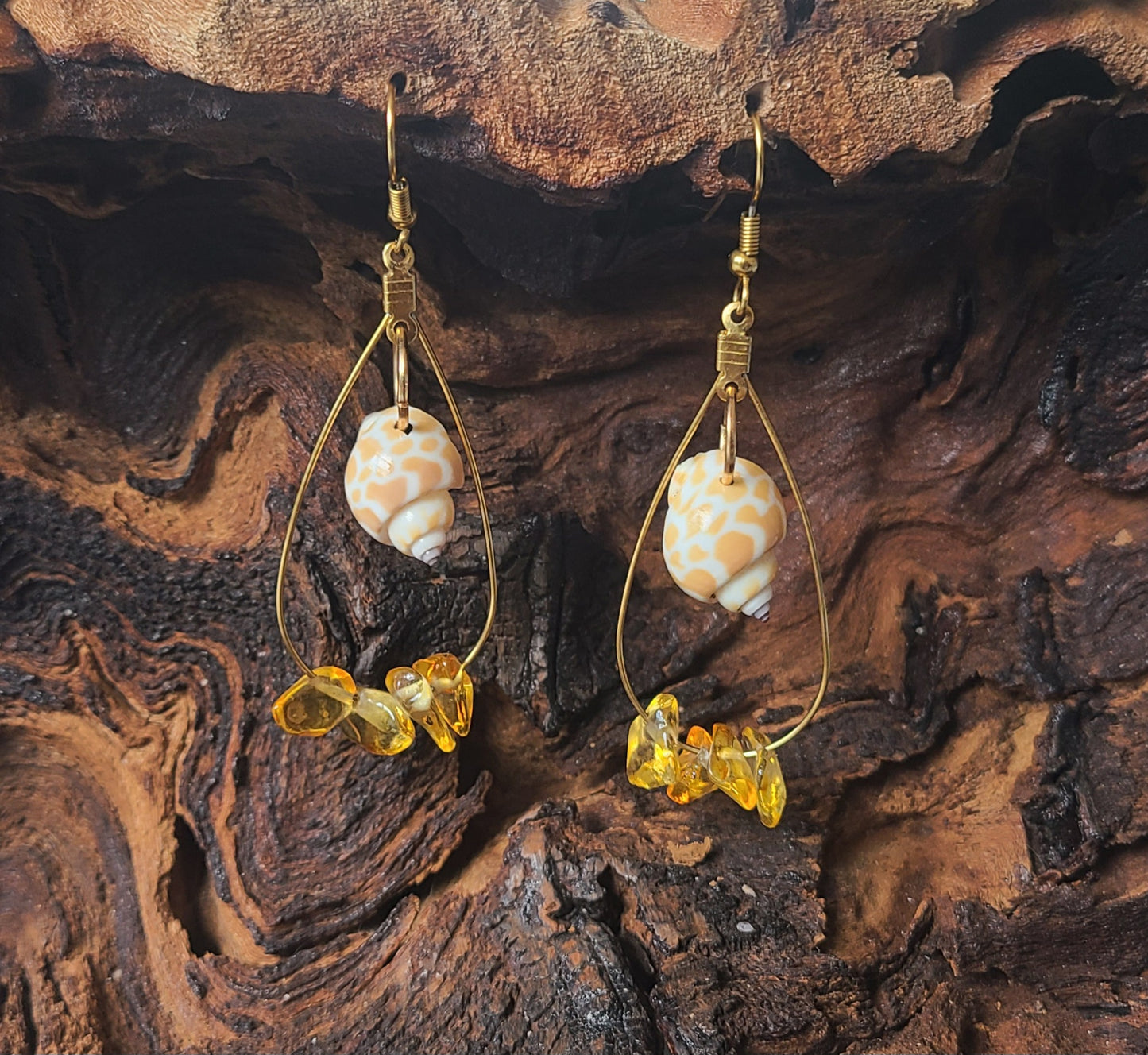 Beautiful Dangle Earrings with Giraffe Print Babylonia Shells and Yellow Amber Colored Stones.